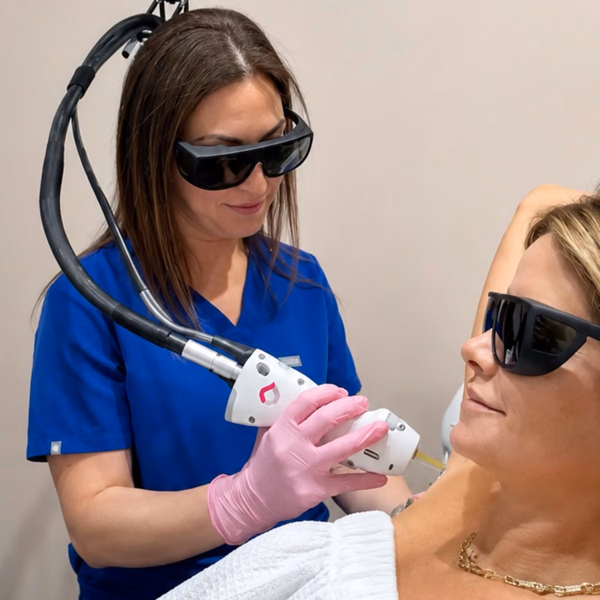 Corinne Aesthetics provider performing a GentleMax Pro Plus laser treatment